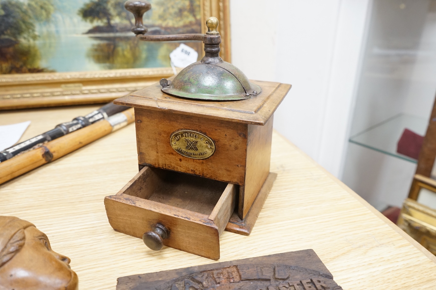 A coffee grinder, a figural nut cracker, two walking sticks, one mother of pearl inlaid and a railway sign